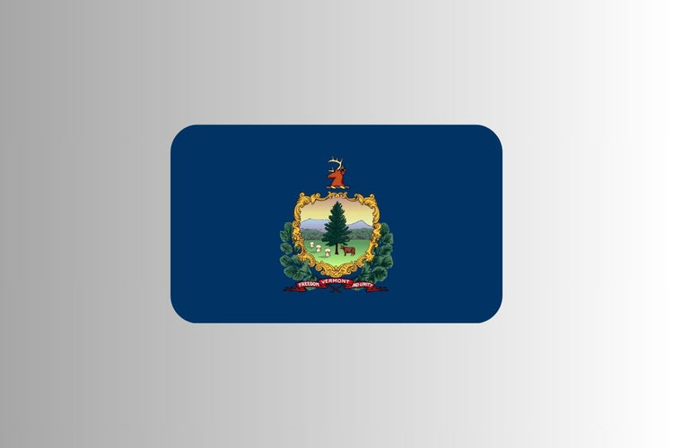 Vermont state flag with a blue field featuring the state coat of arms: a pine tree, cow, and sheaves of wheat in a green landscape, with a stag’s head above and a red banner reading “Freedom and Unity.”