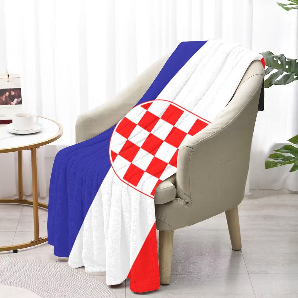 Luv My Flag Croatia-themed blanket on beige armchair.
