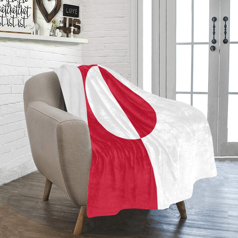Cozy chair with Luv My Flag red-and-white blanket.