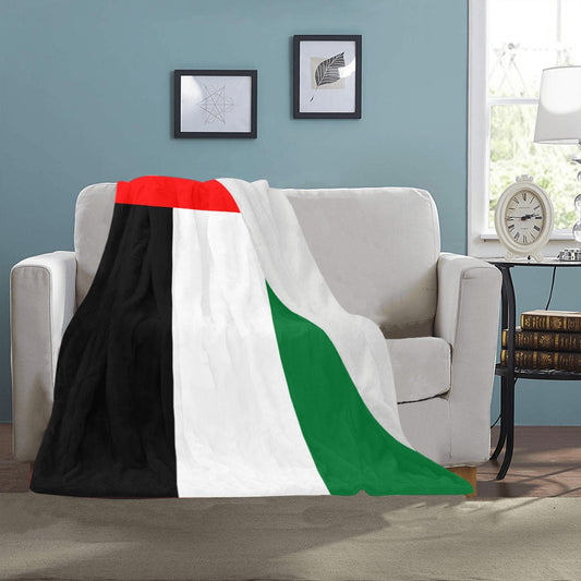 Cozy Luv My Flag blanket draped over white sofa.