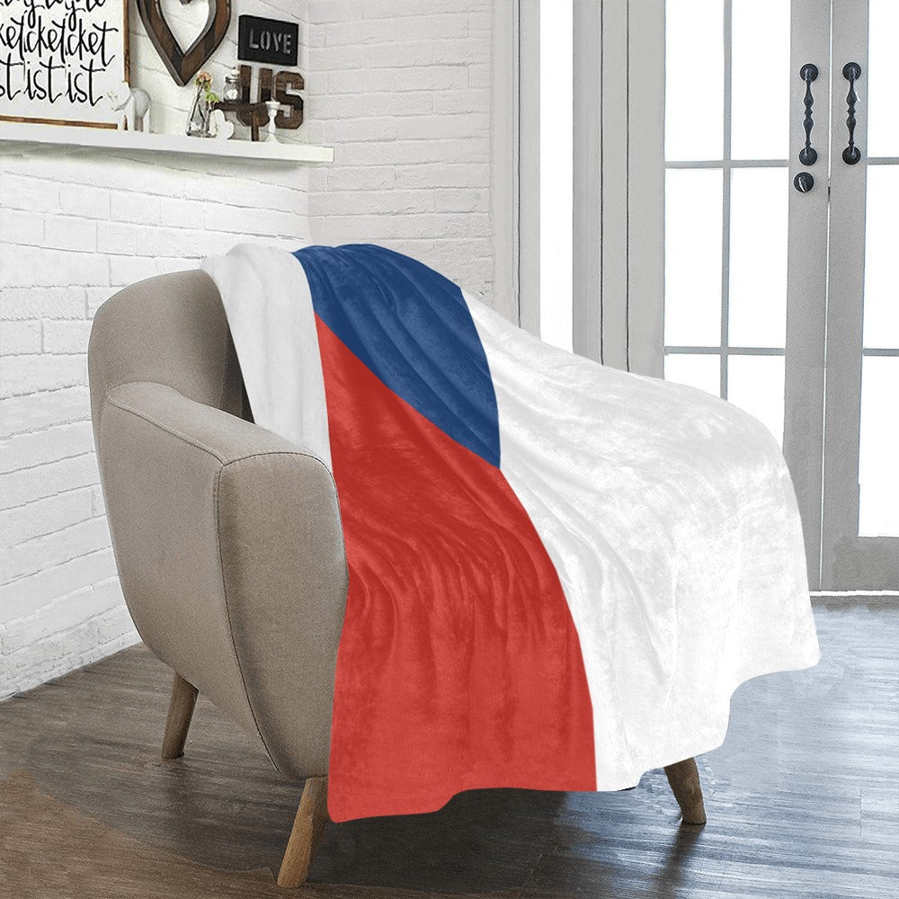 Cozy chair with Luv My Flag patriotic blanket draped.