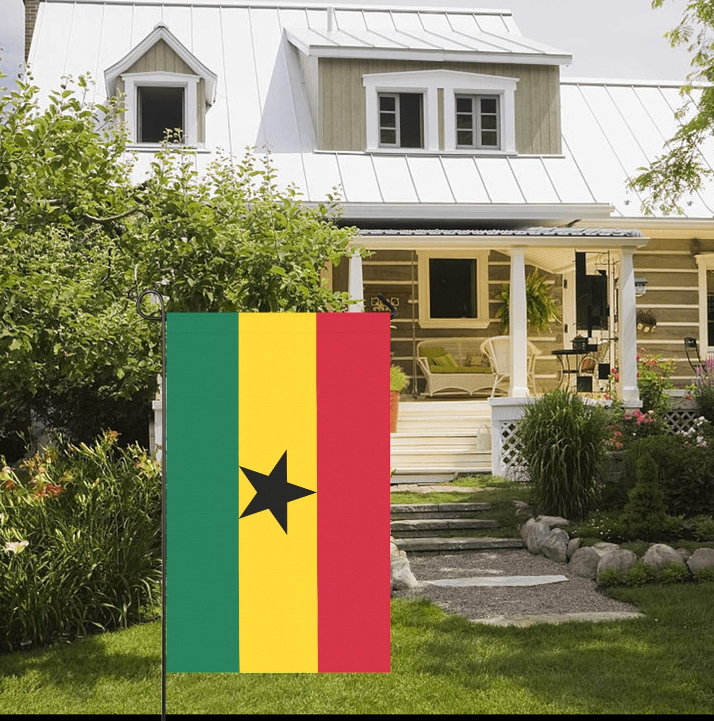 House with garden, displaying Luv My Flag's Ghana flag.