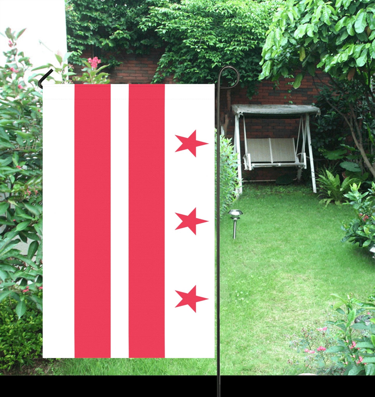 Luv My Flag: Red stars and stripes in garden setting.