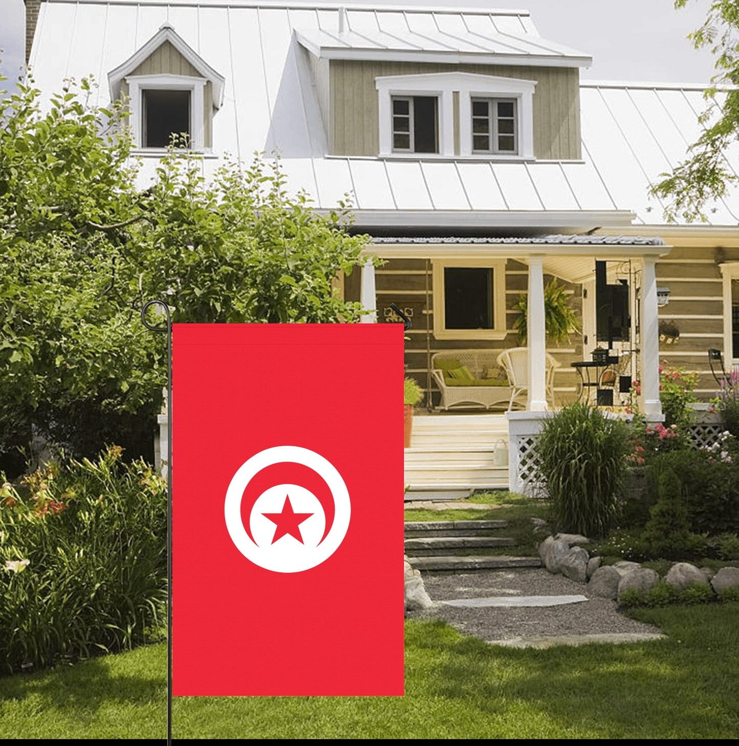 Red flag with white symbol outside house, by Luv My Flag.