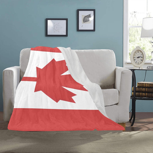 Cozy couch adorned with Luv My Flag Canadian blanket.