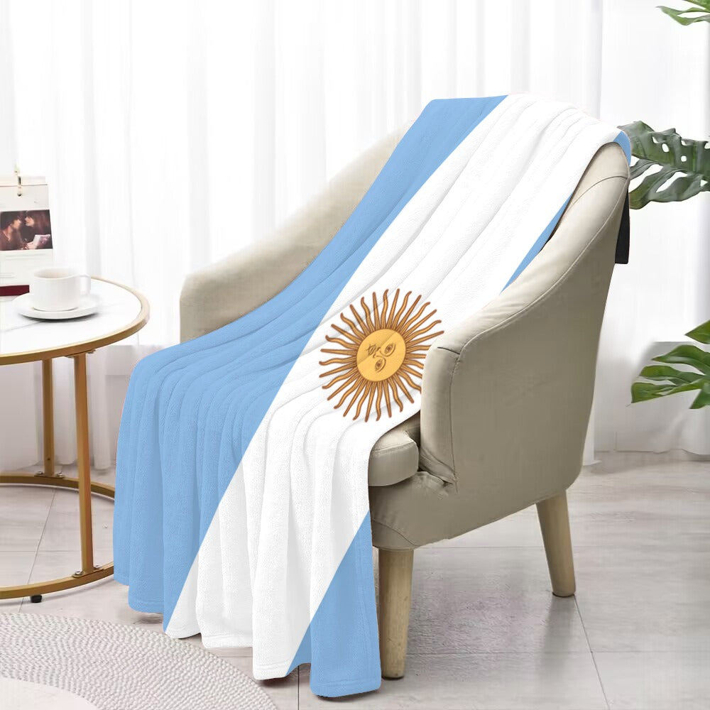 Luv My Flag blanket with Argentine design draped on chair.