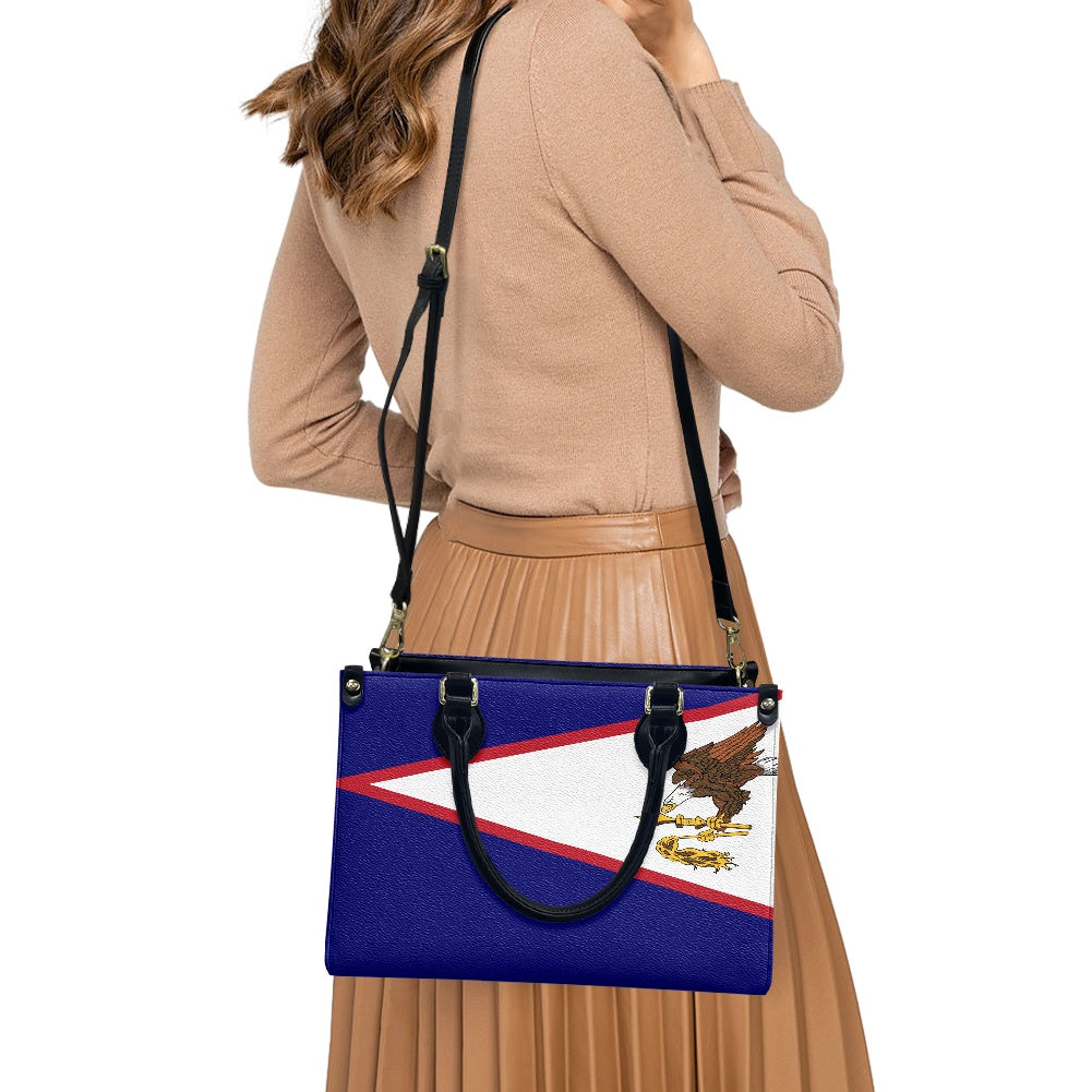 Woman carrying Luv My Flag bag with unknown flag design.
