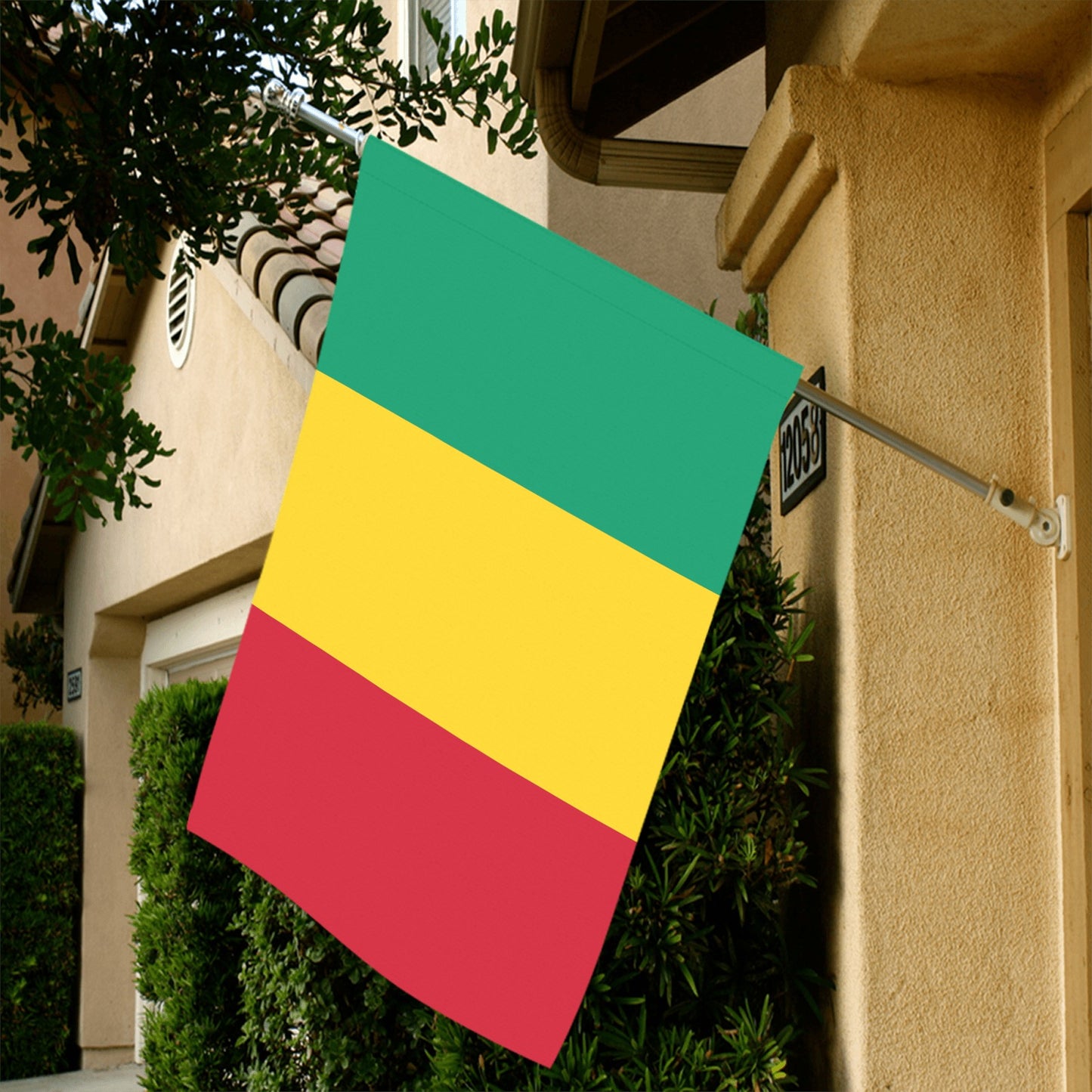 House displaying Luv My Flag tricolor flag outside entrance.