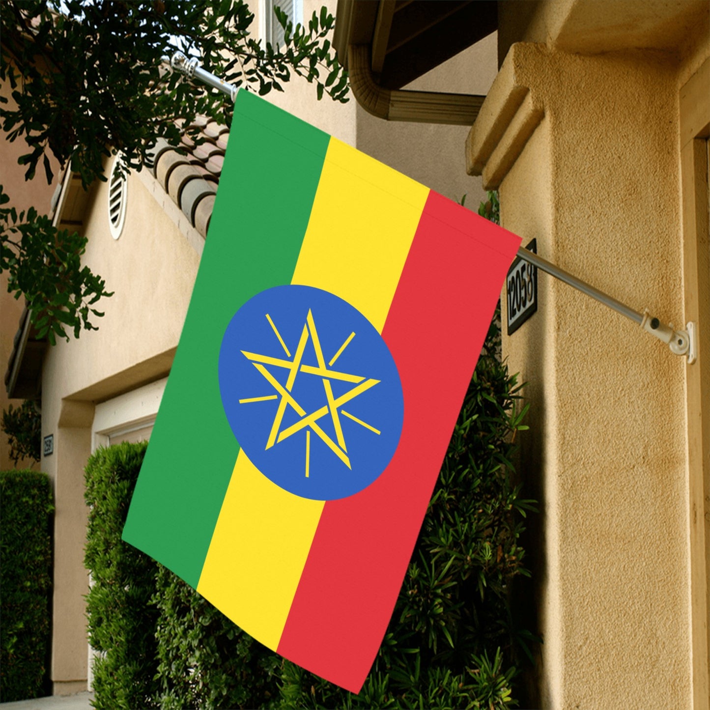 Luv My Flag's Ethiopian flag displayed on house wall.