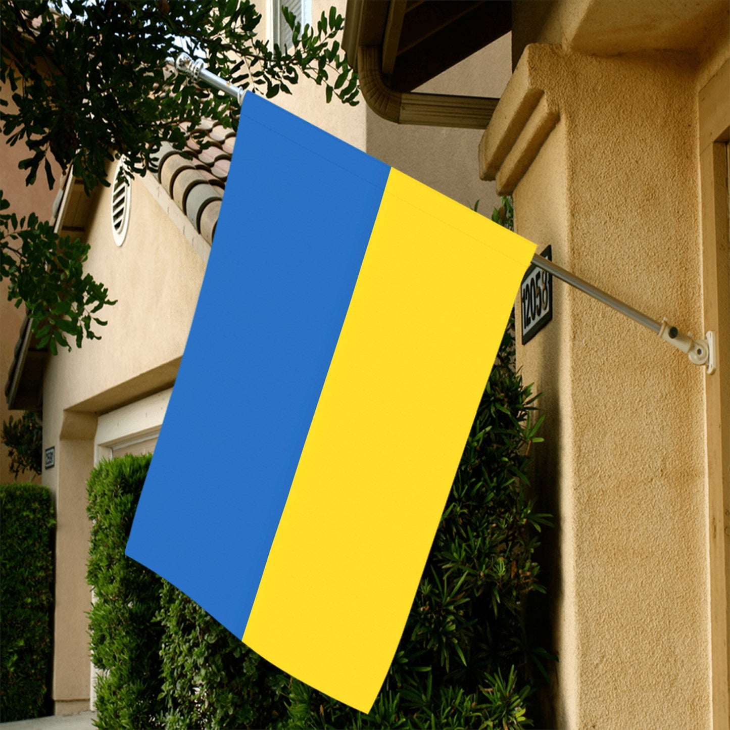 House displaying Luv My Flag's blue-yellow flag outdoors.