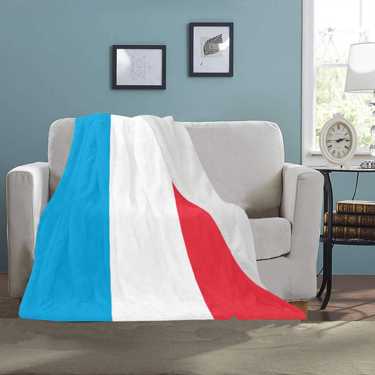 Luv My Flag blanket with bright tri-color design draped.