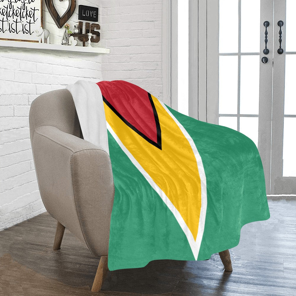 Cozy chair draped with colorful Luv My Flag blanket.