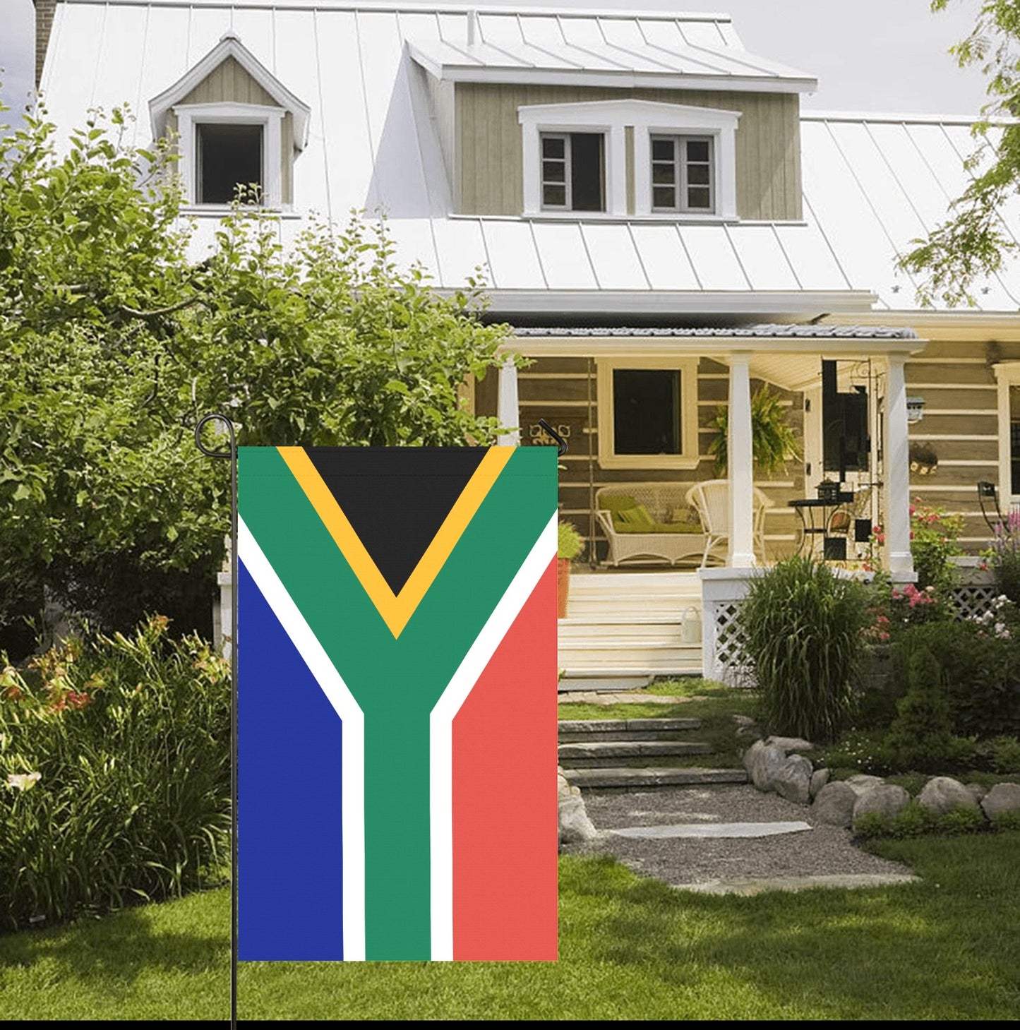 House with Luv My Flag; South African flag displayed outside.