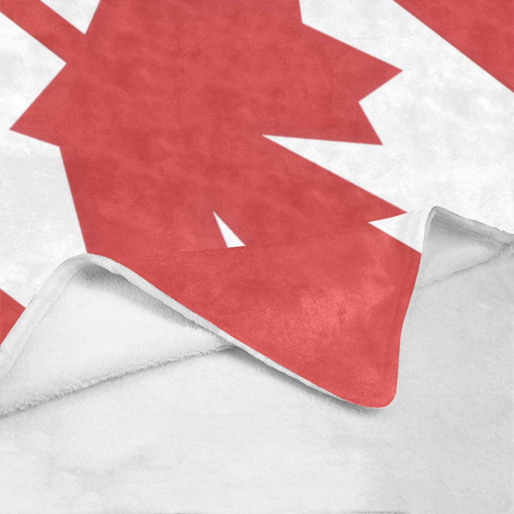 Luv My Flag cozy blanket with red maple leaf design.