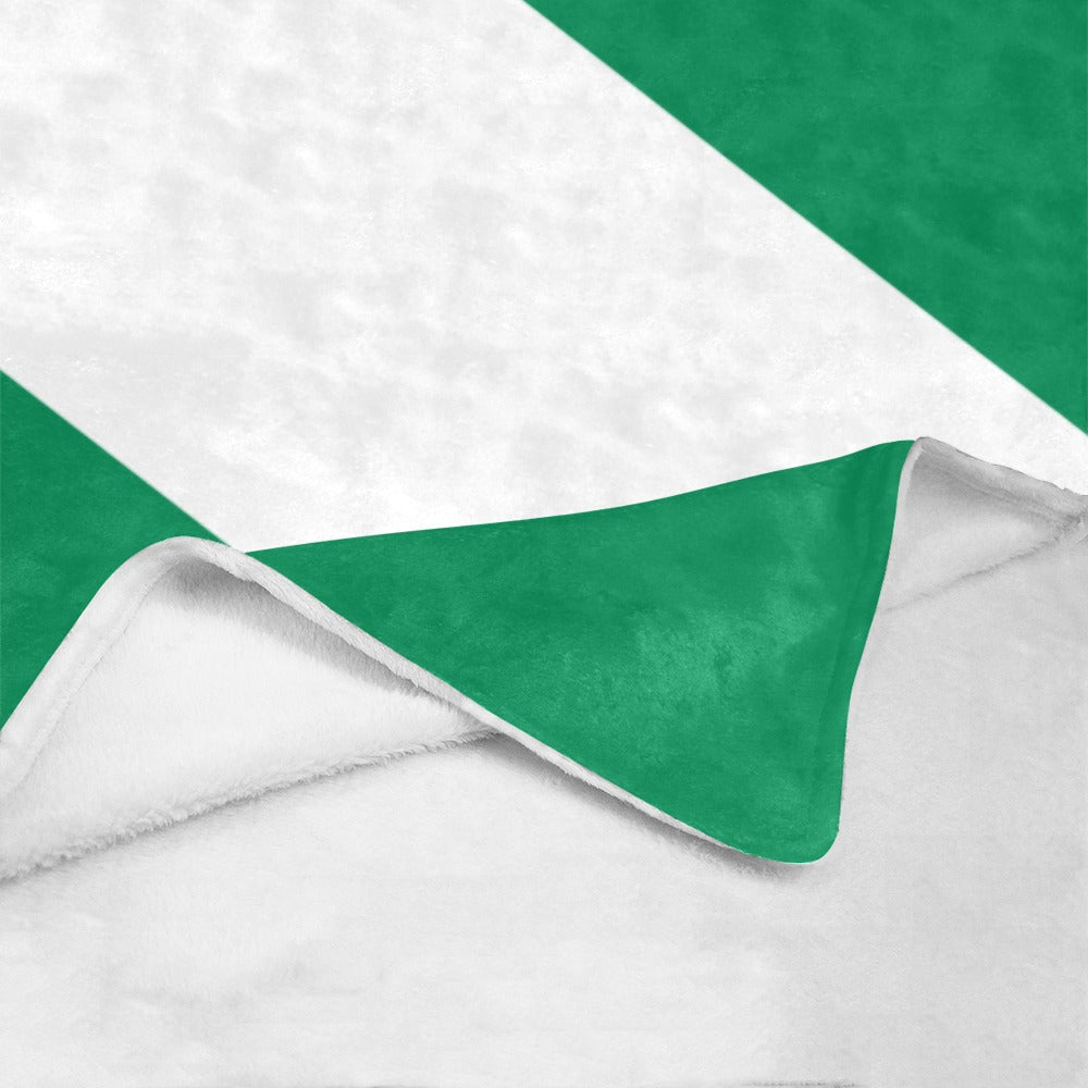 Luv My Flag green and white blanket, partially folded corner.