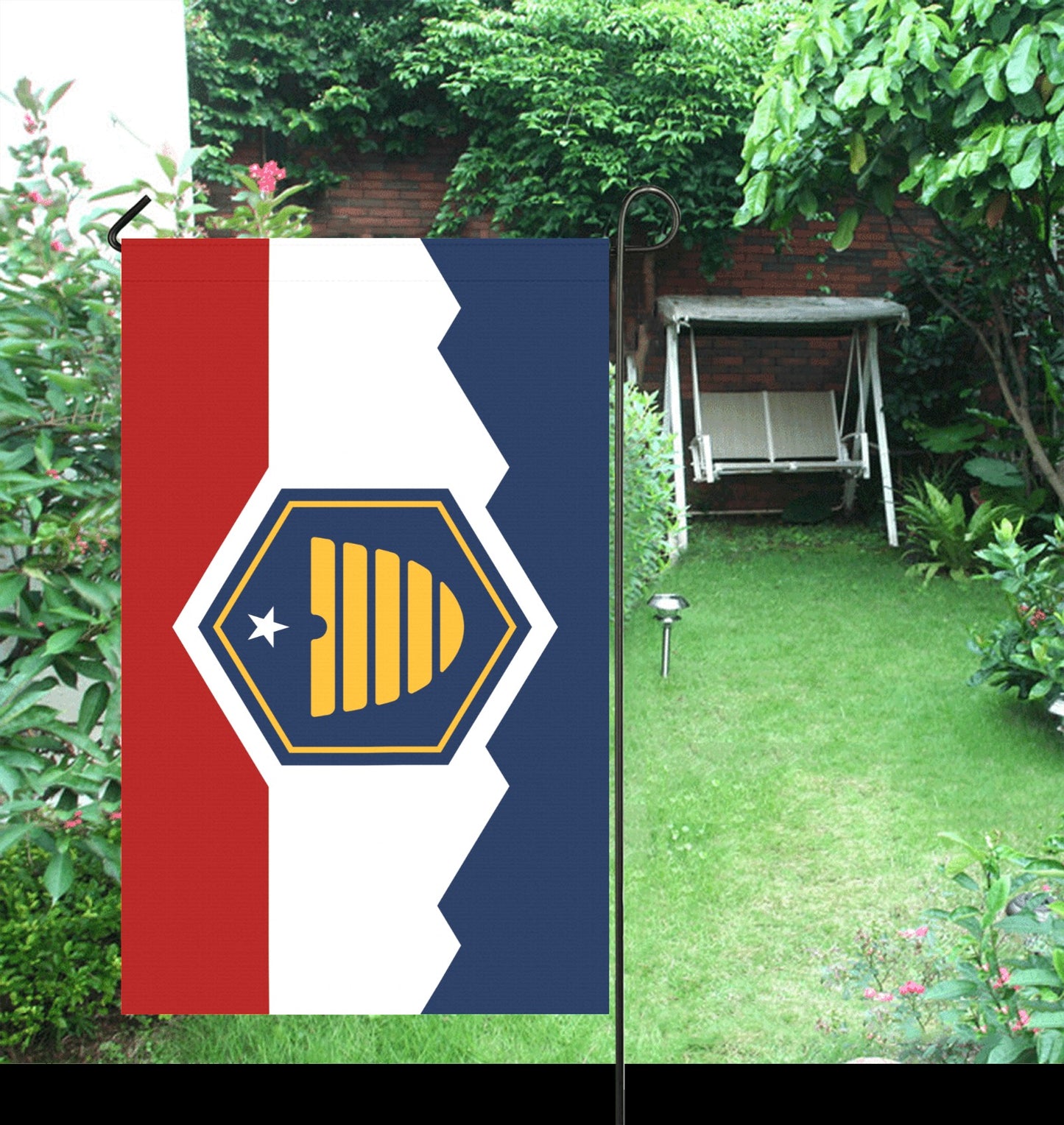 Flag by Luv My Flag displayed in garden setting.