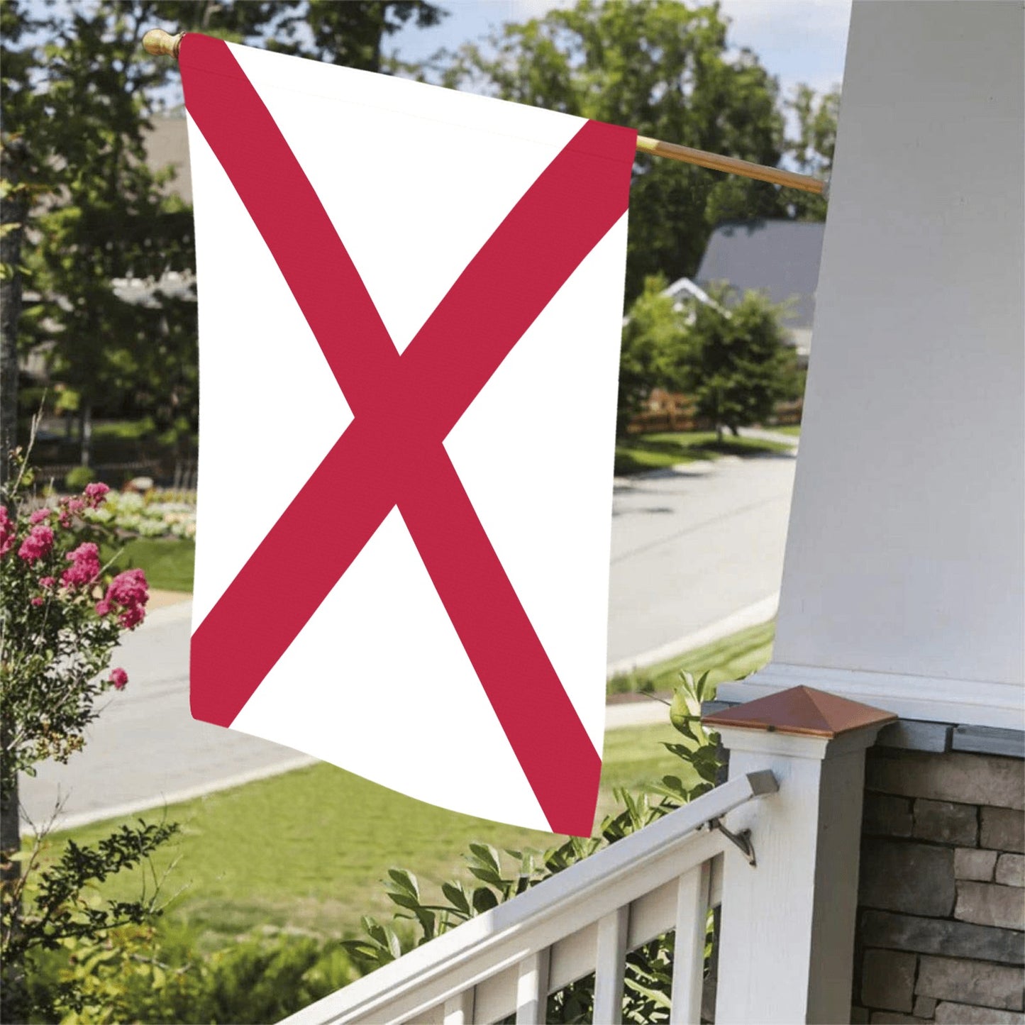"Luv My Flag: Alabama flag displayed on porch railing."