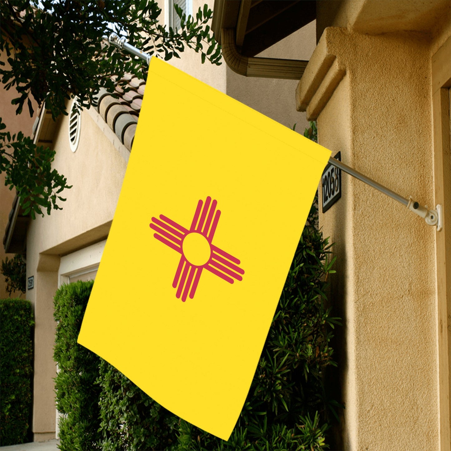 Yellow flag with red symbol hangs outside, Luv My Flag.