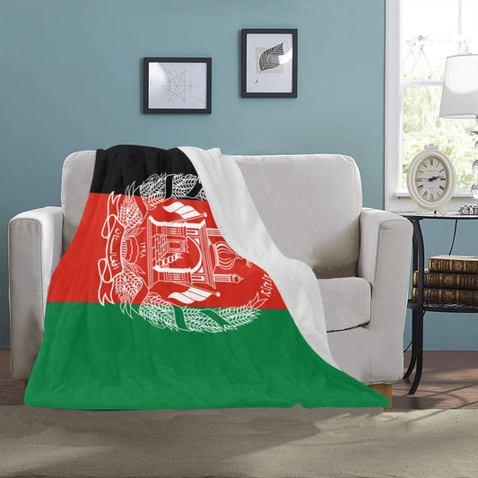 Cozy blanket featuring Afghanistan flag on a white couch. Luv My Flag.