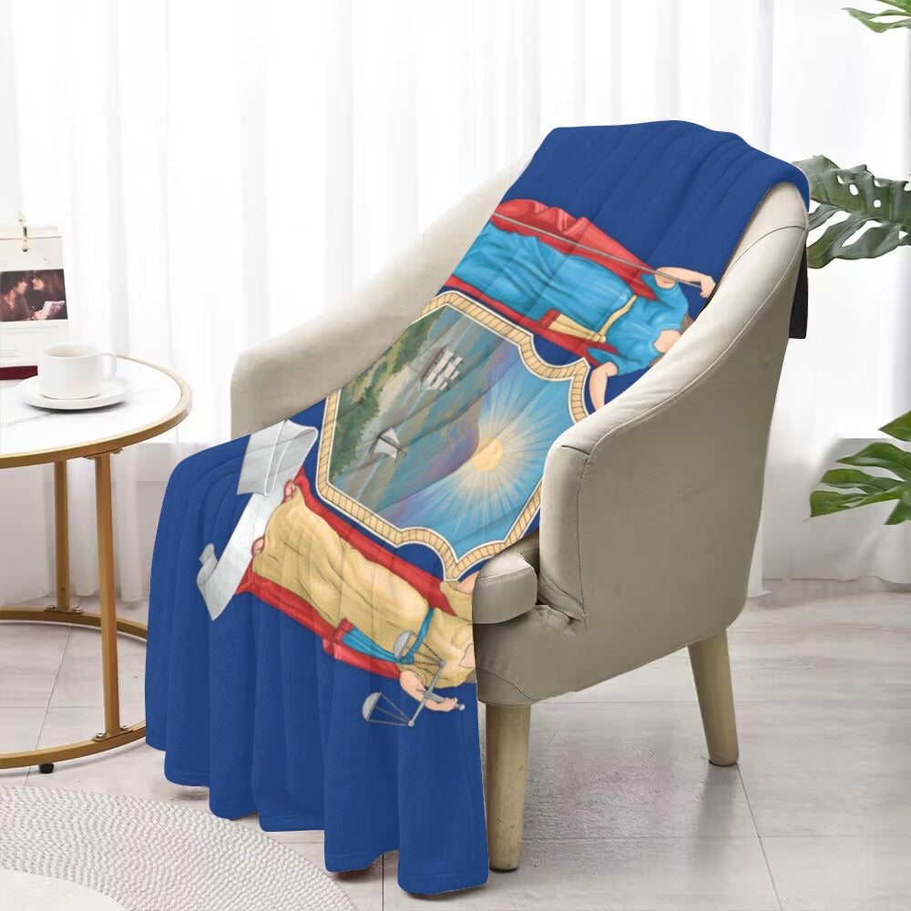 Cozy armchair draped with Luv My Flag blanket design.