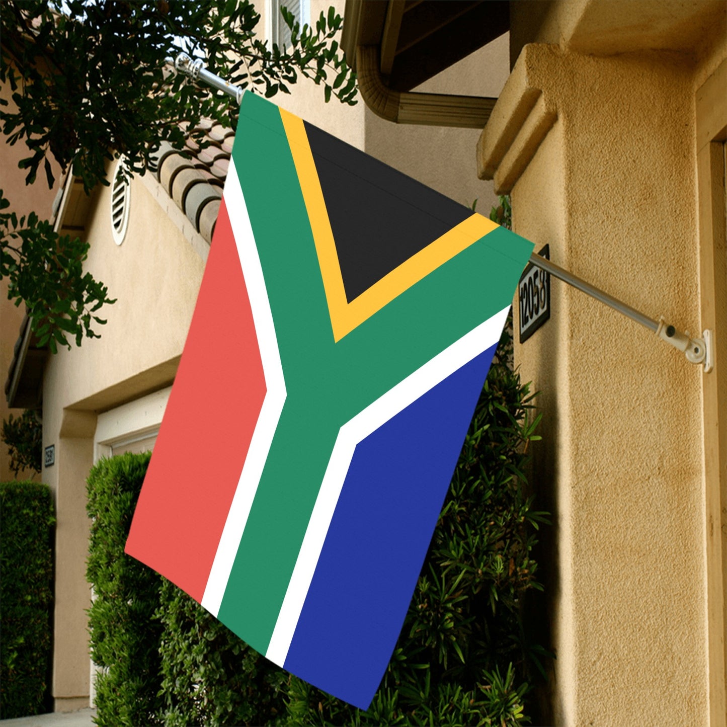 South African flag displayed outside house, Luv My Flag.