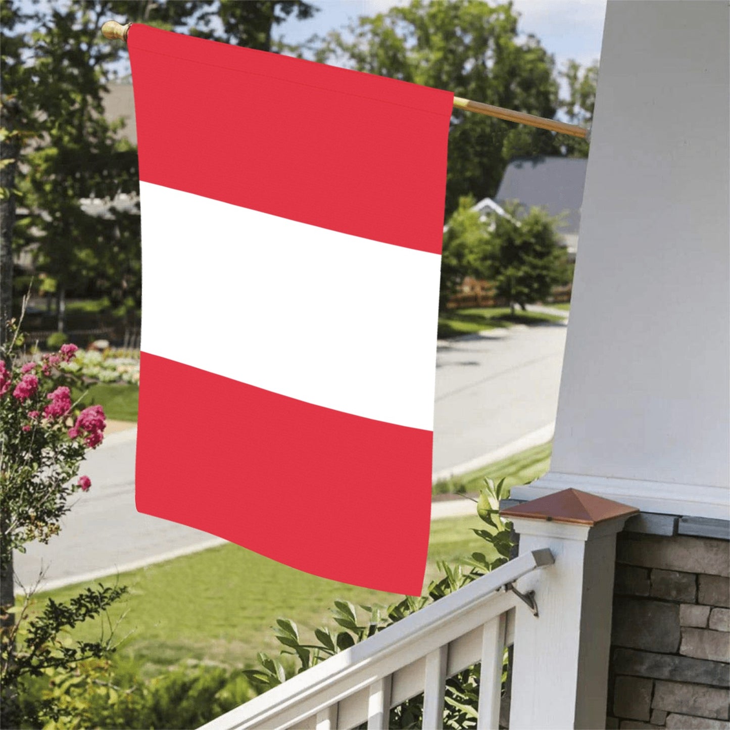 Red and white Luv My Flag on porch railing.