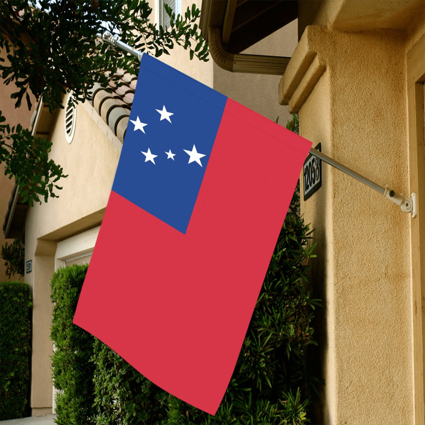 Luv My Flag Samoan flag displayed outside suburban house.