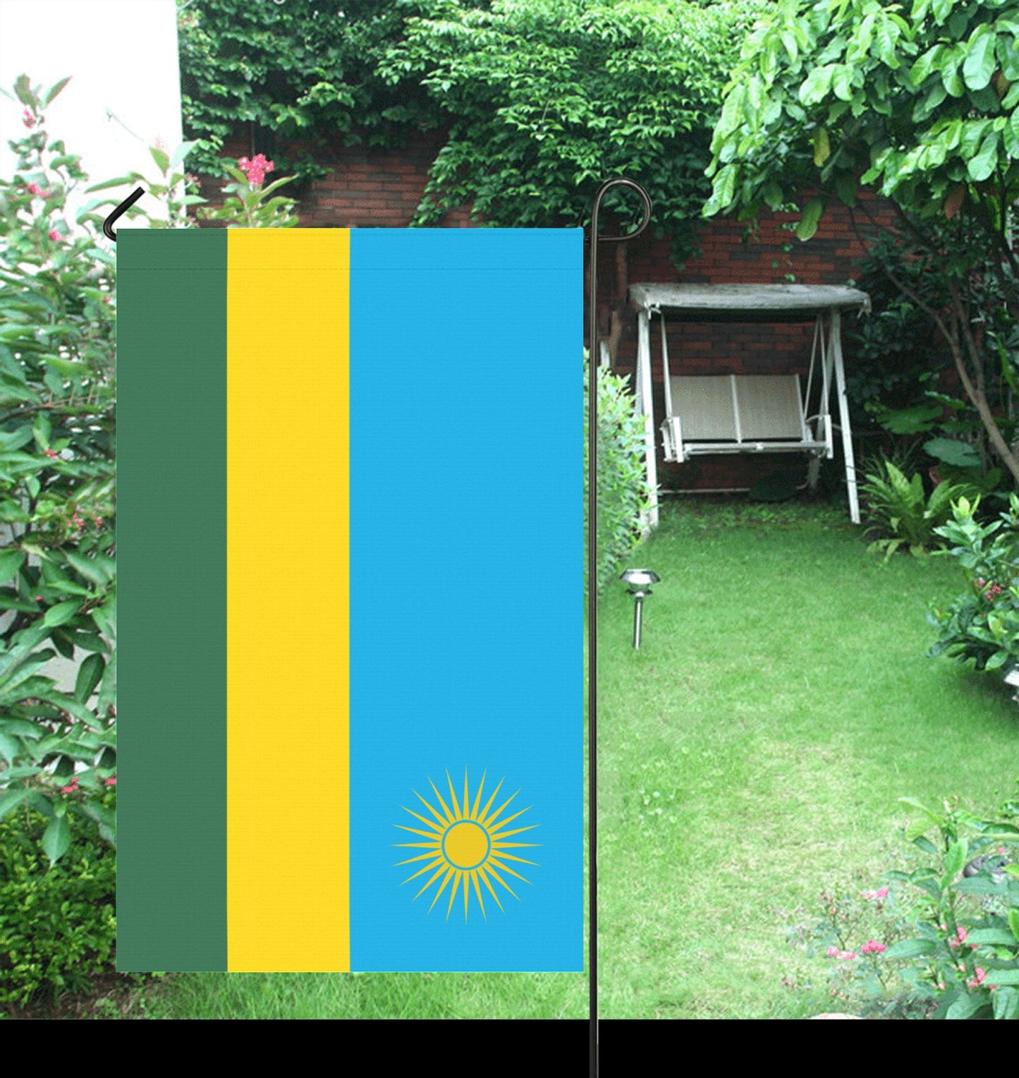 Luv My Flag garden flag in colorful, lush backyard setting.