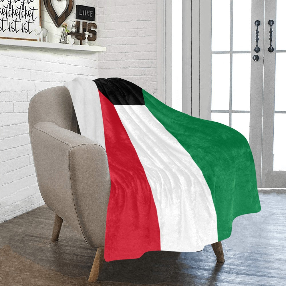 Cozy chair draped with Luv My Flag Kuwaiti blanket.
