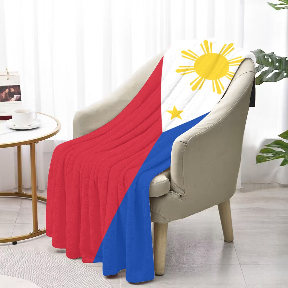 Comfy chair with Luv My Flag Philippine-themed blanket draped.