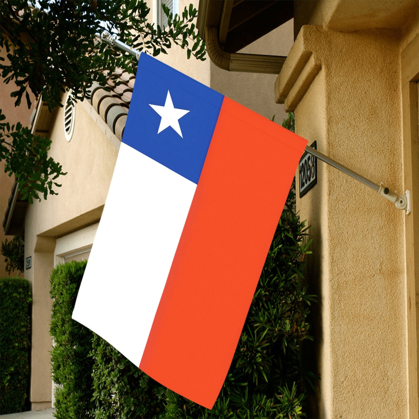 Flag with star displayed outside house, by Luv My Flag.