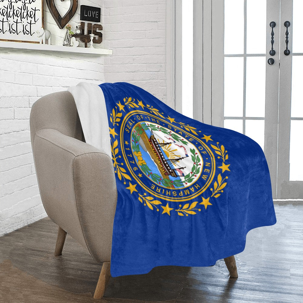 Soft blue blanket with New Hampshire seal, Luv My Flag.