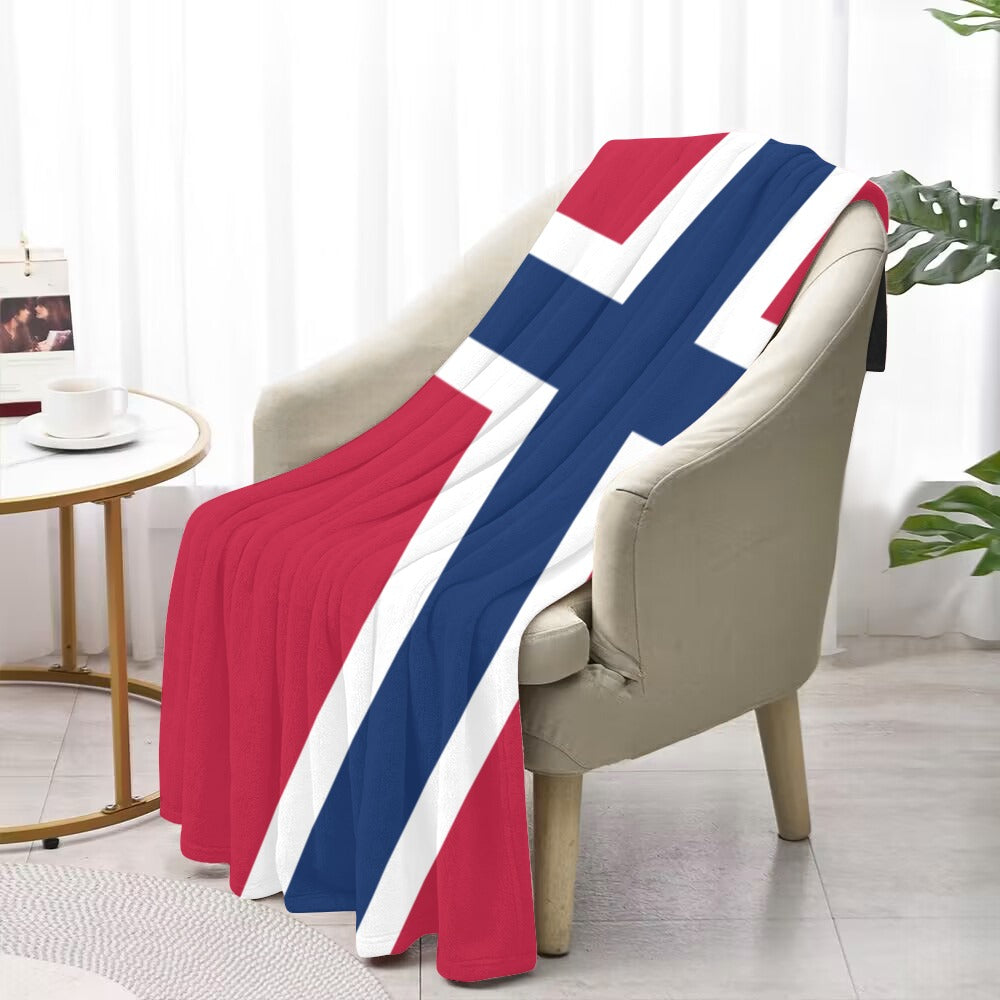 Cozy chair draped with Luv My Flag's vibrant blanket.