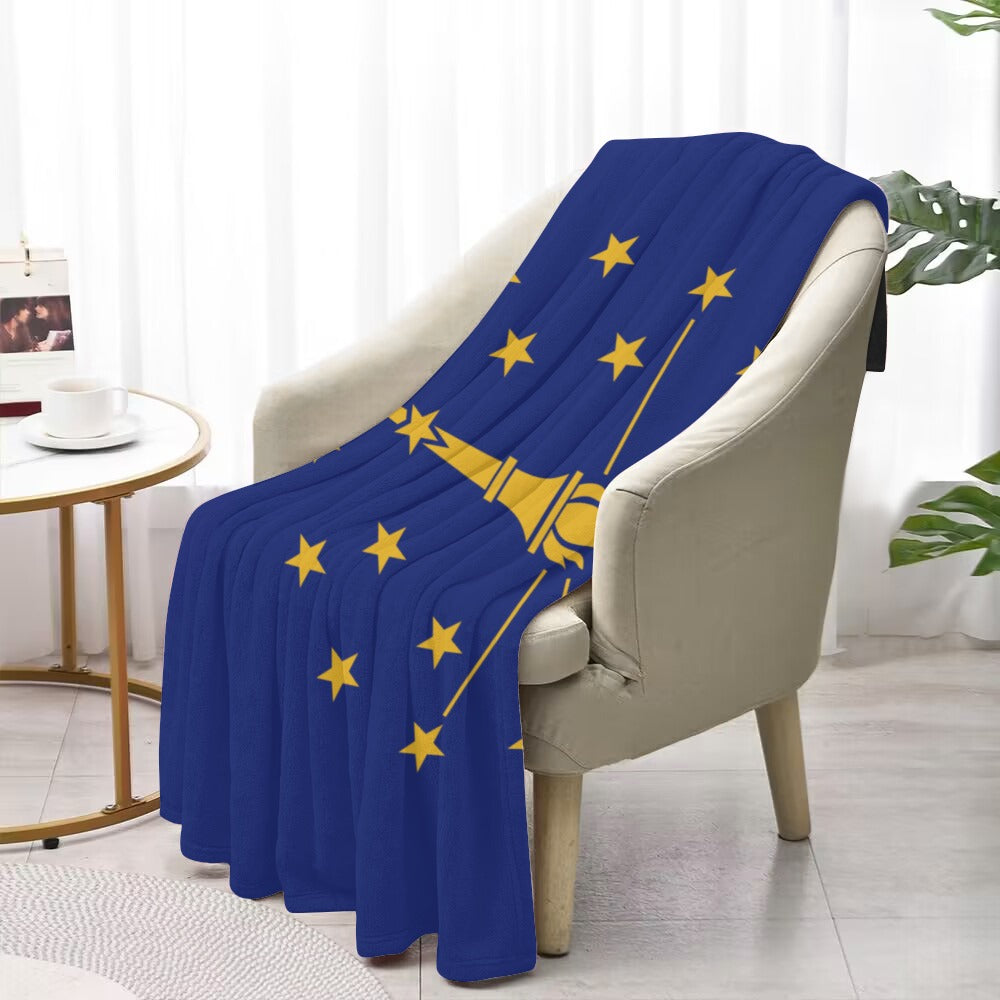 Luv My Flag blue blanket, yellow stars, on chair.
