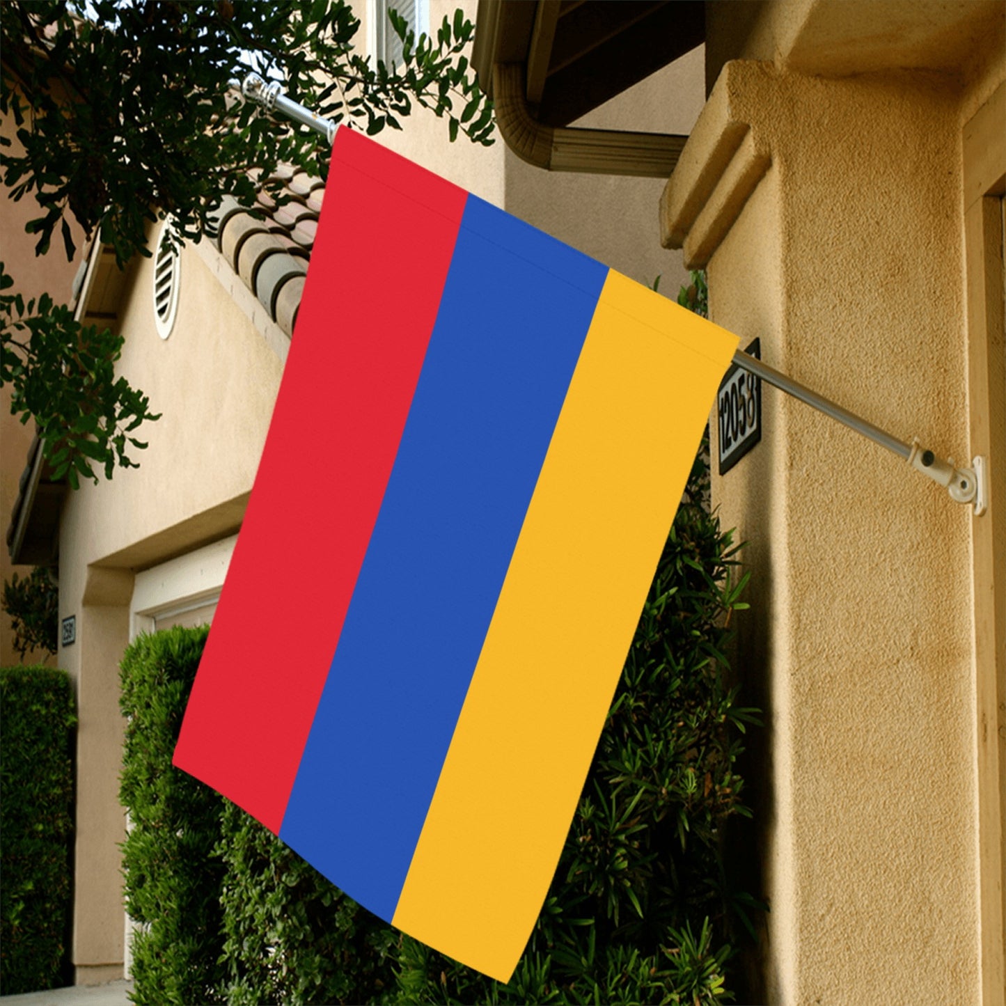 Luv My Flag's red, blue, yellow flag displayed outside.