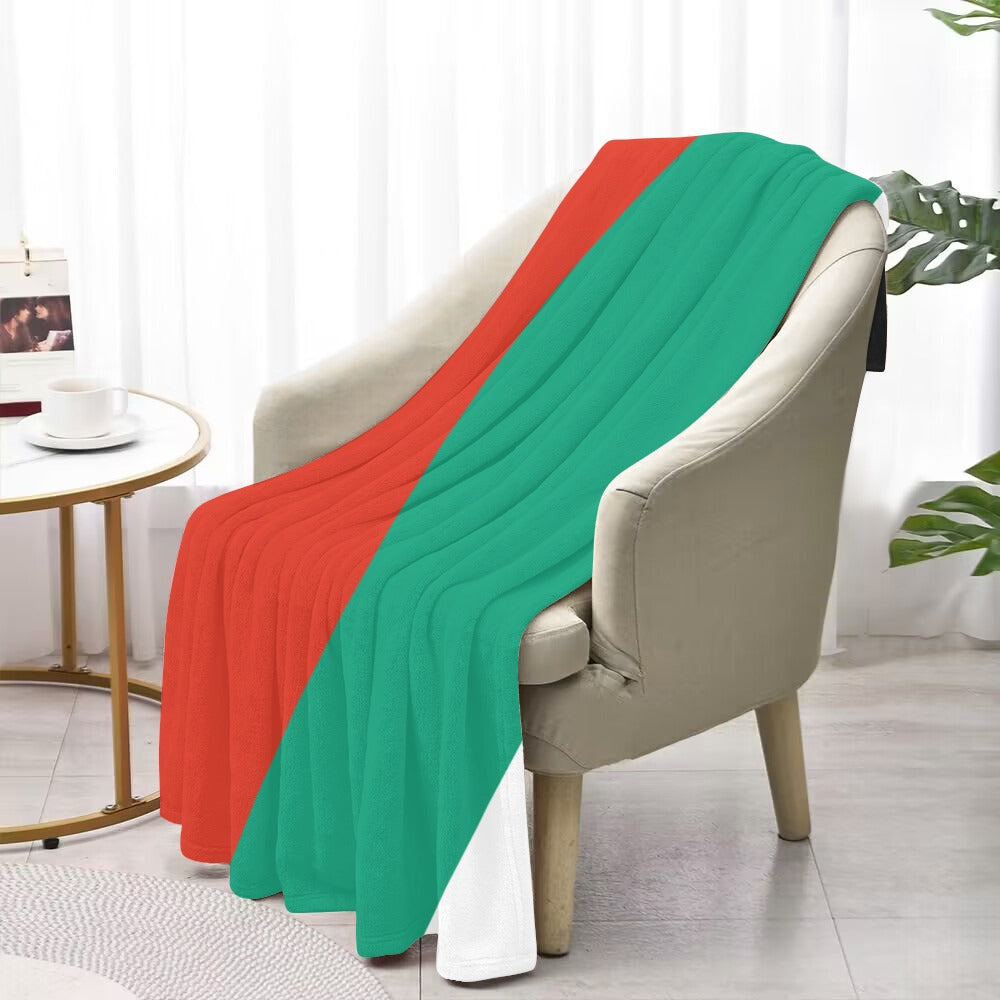 Luv My Flag blanket, red and green on chair.