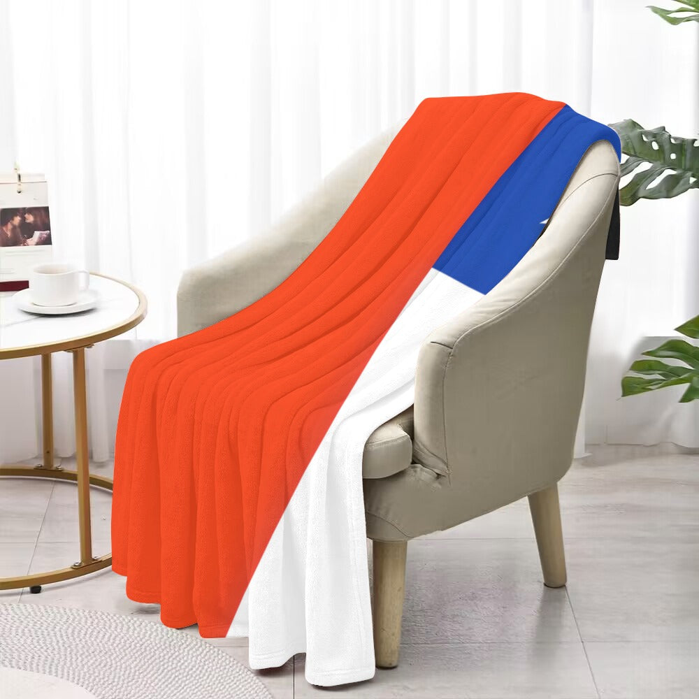 Luv My Flag blanket on chair, red, blue, white.