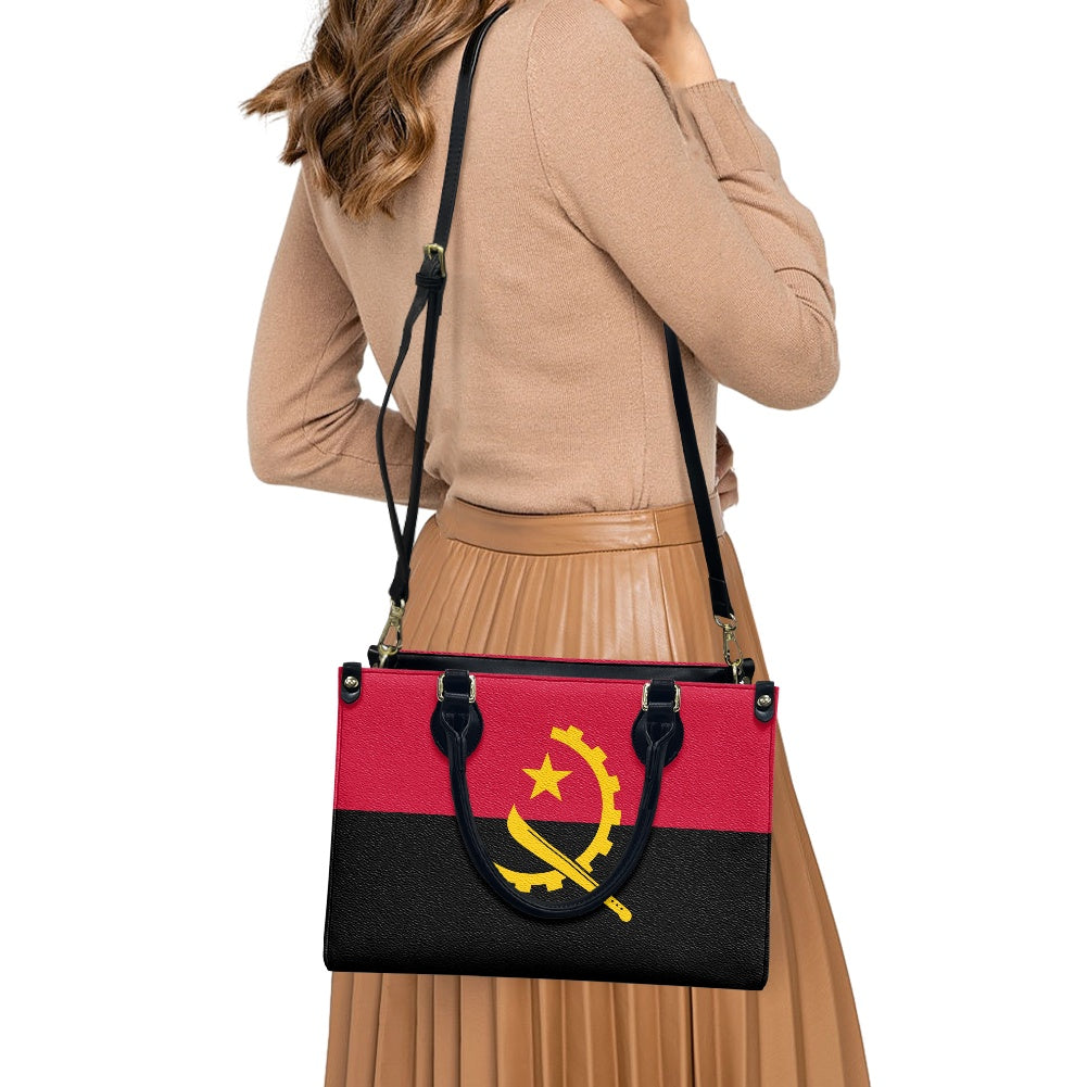 Woman wearing Luv My Flag bag with Angola flag design.