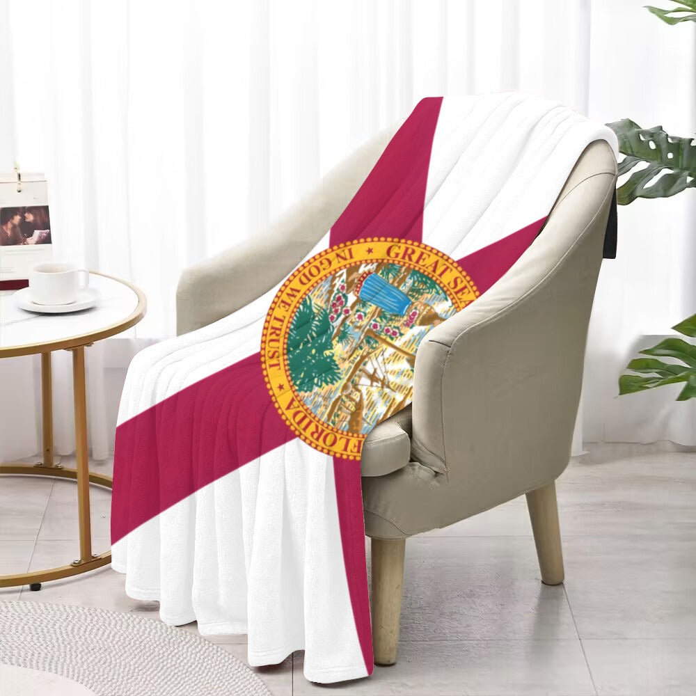 Cozy chair draped with Luv My Flag Florida blanket.
