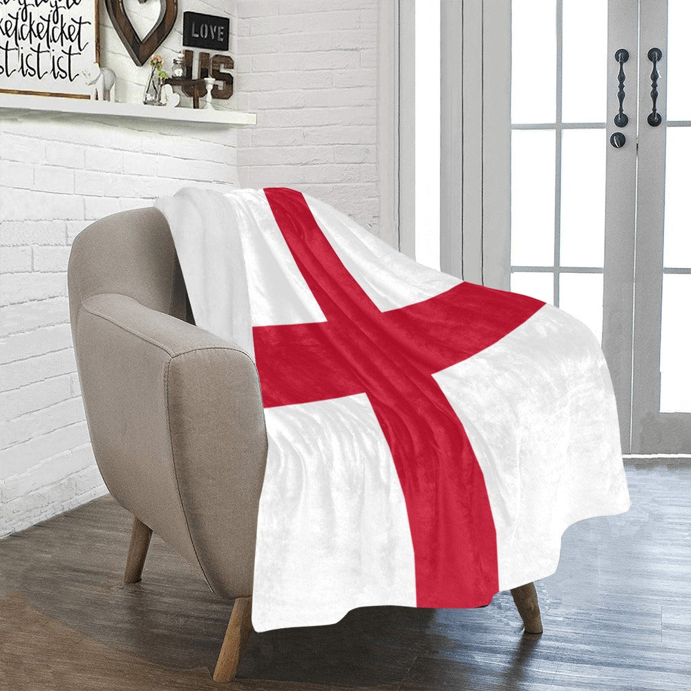 Cozy chair with Luv My Flag blanket draped over.