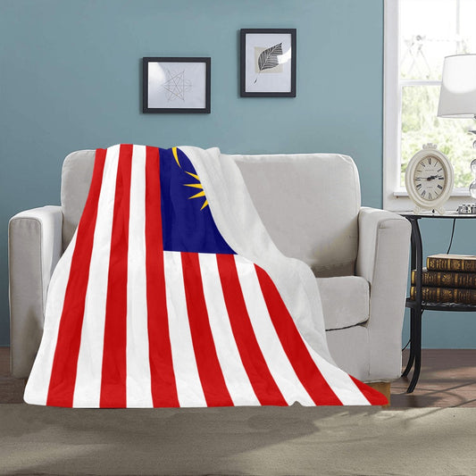 Luv My Flag blanket with Malaysia flag on sofa.