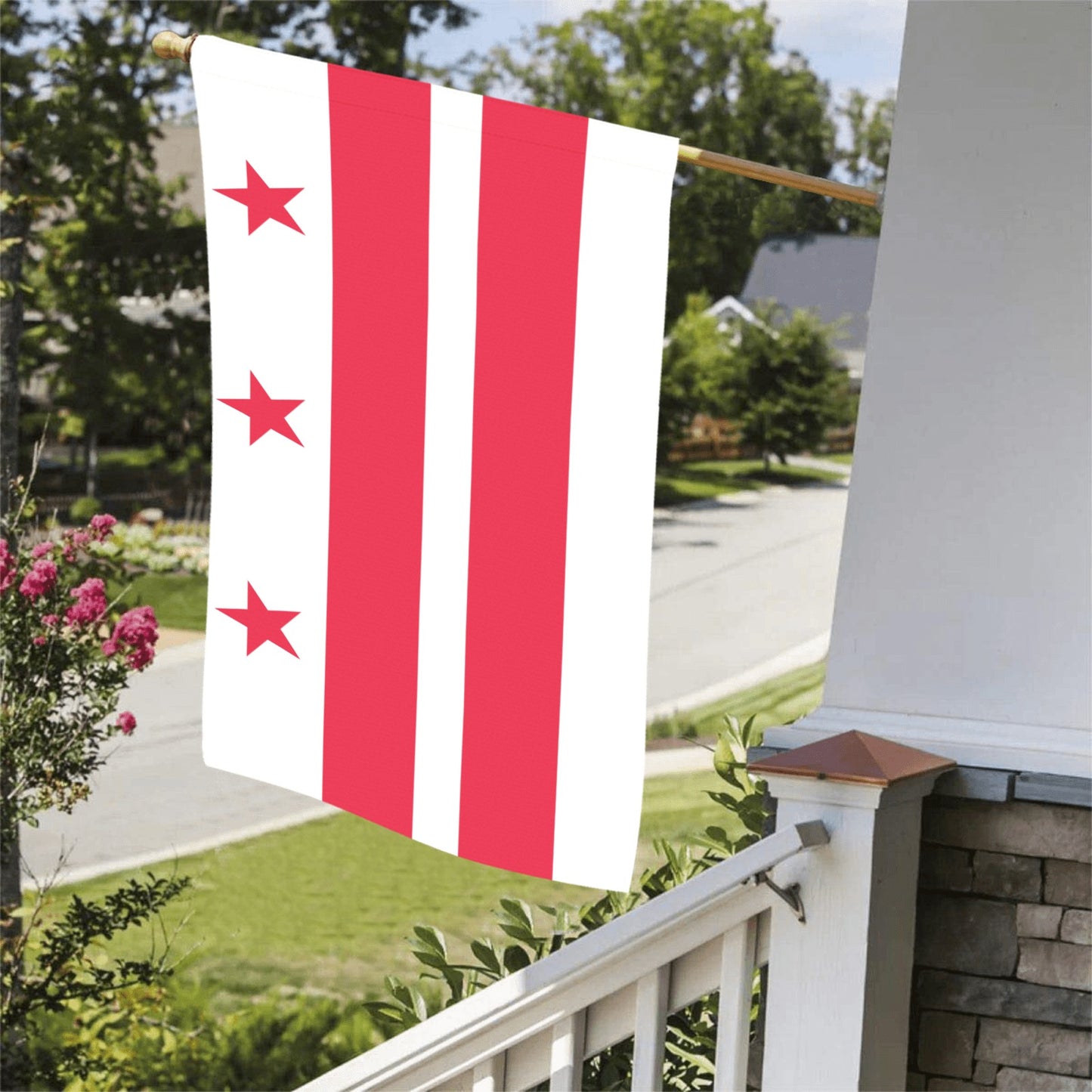 Luv My Flag brand flag hangs on porch, three stars.