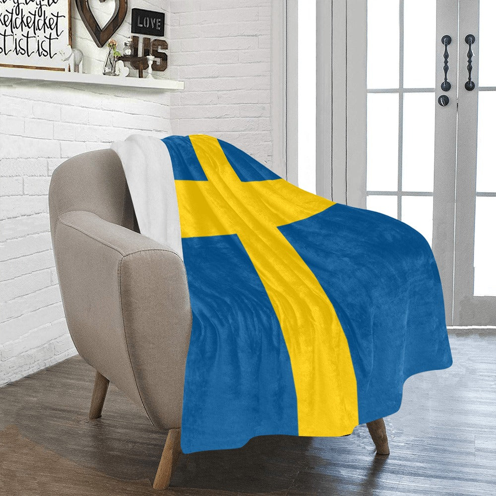 Cozy chair with Luv My Flag Swedish flag blanket.