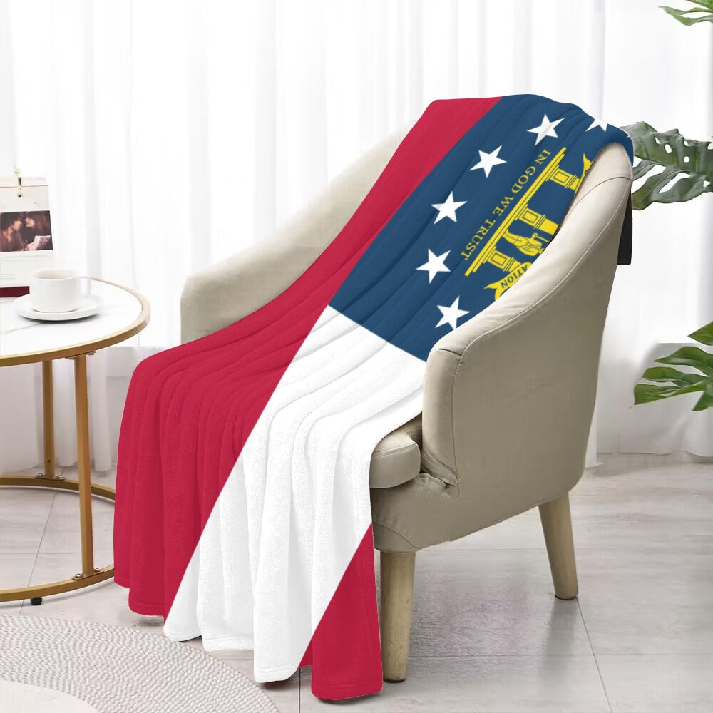 Cozy chair with Luv My Flag Georgia-themed blanket.