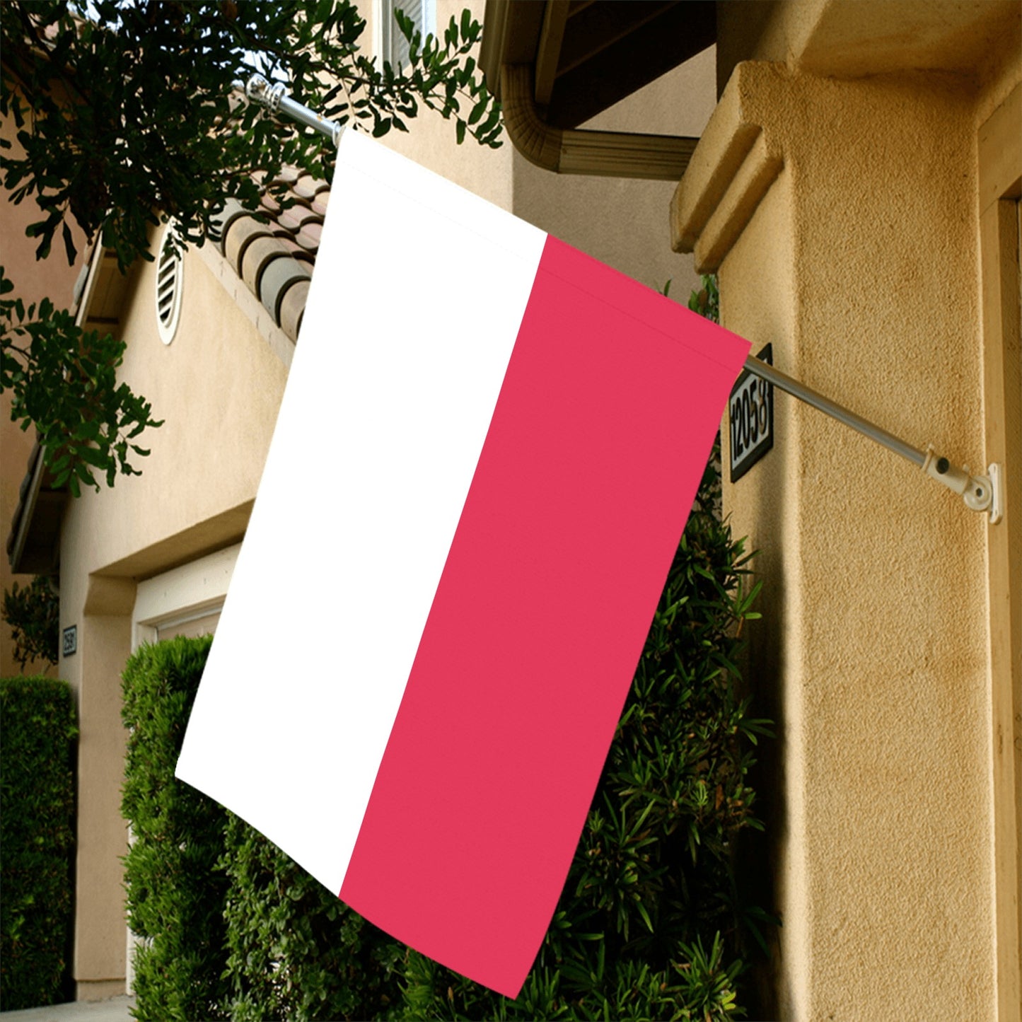 Luv My Flag red and white flag displayed outside home.