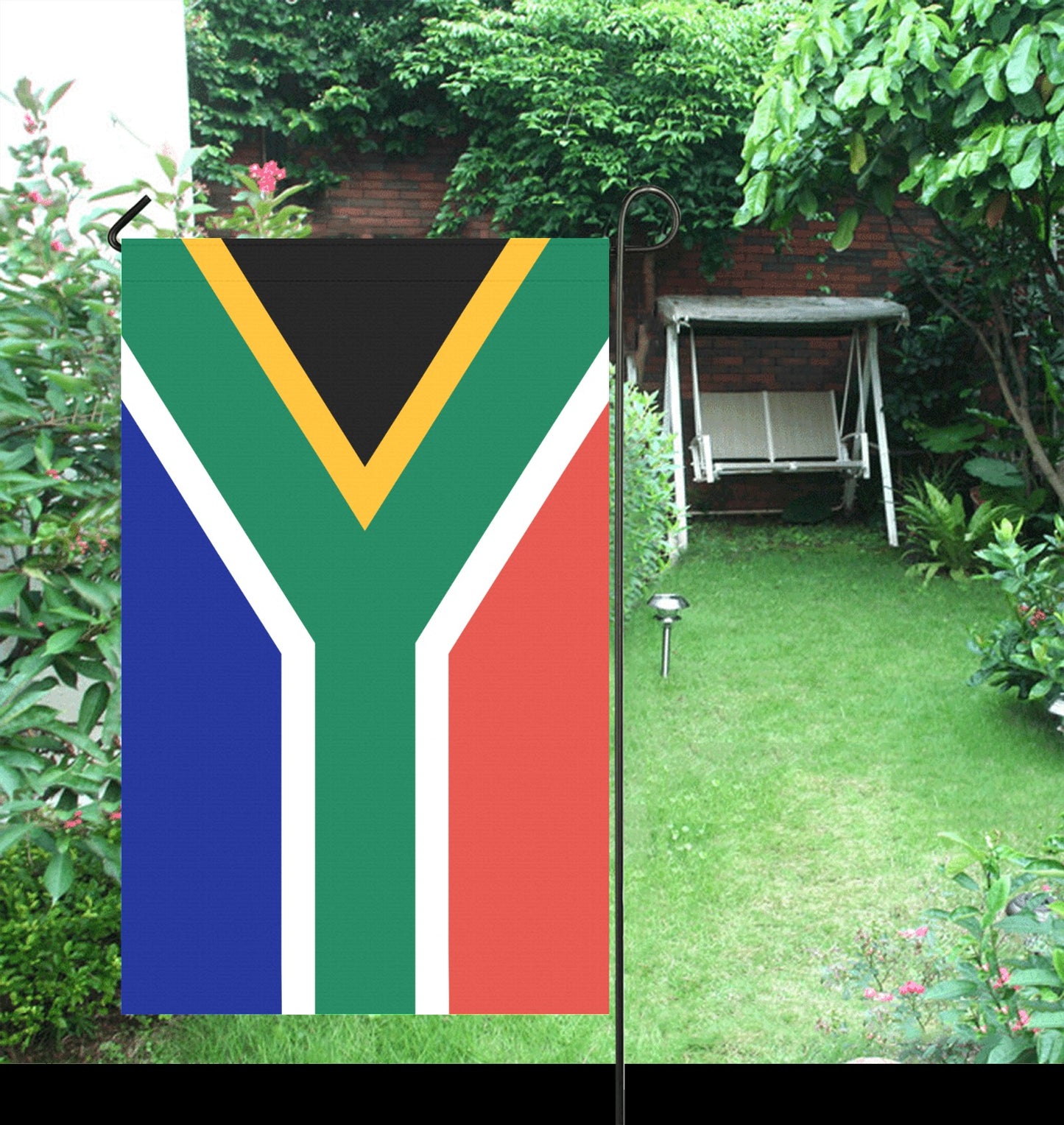 Luv My Flag garden flag with South African design displayed outside.