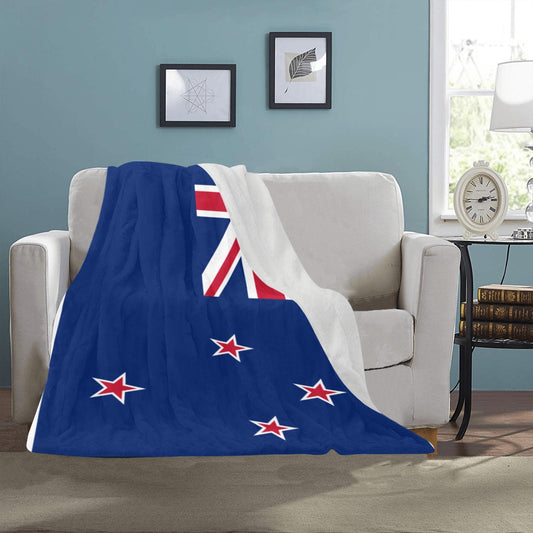 Cozy white couch with Luv My Flag New Zealand blanket.