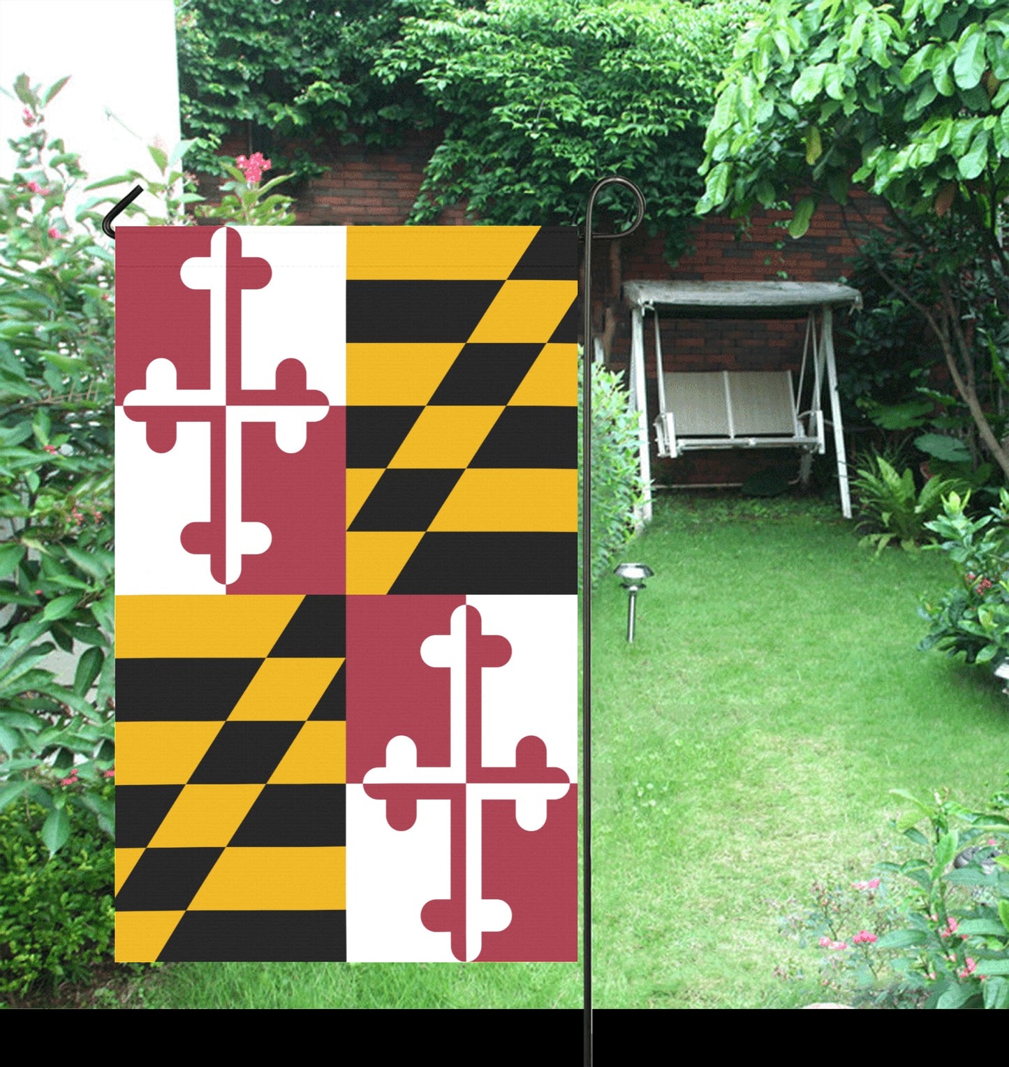 Garden scene featuring Luv My Flag's decorative Maryland flag.