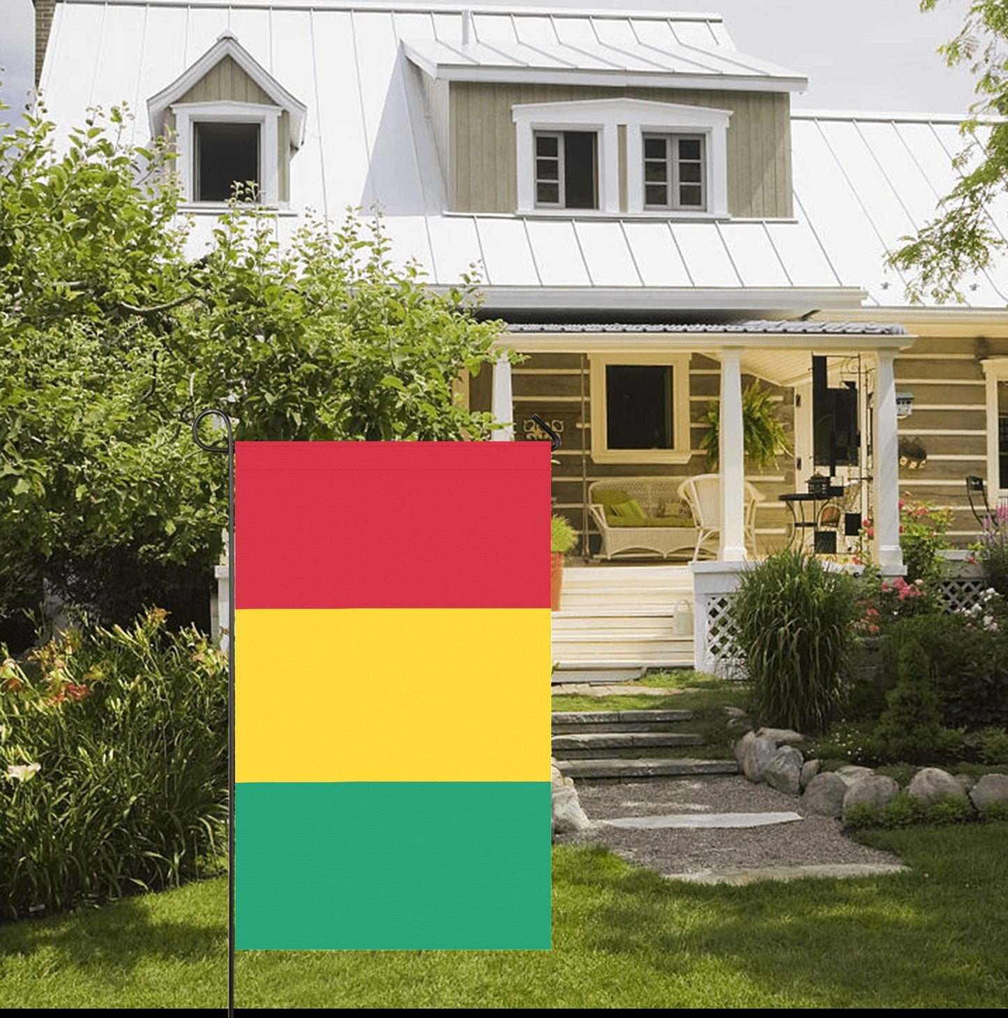 Front porch with garden, featuring Luv My Flag outside.