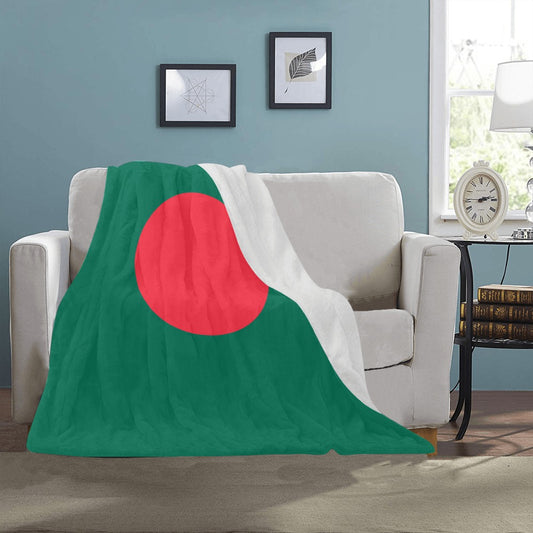 Cozy couch draped with Luv My Flag's Bangladeshi blanket.